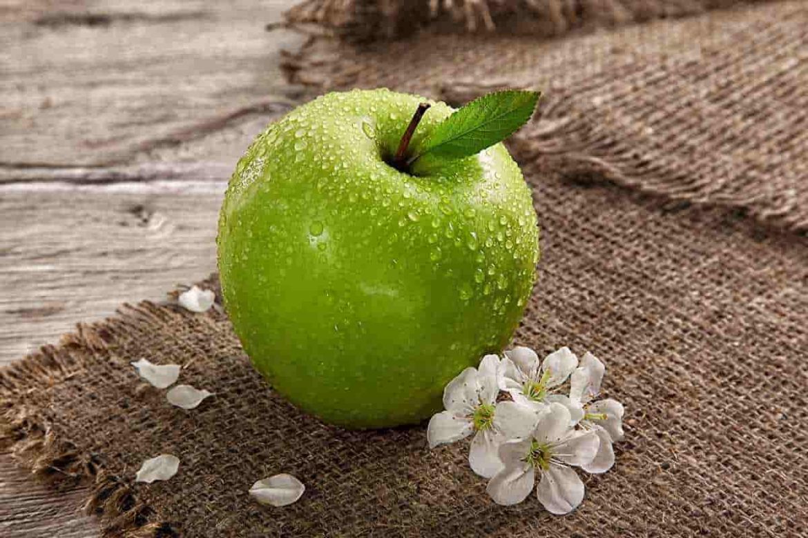 Tiny green apple like fruit in the fruit shops